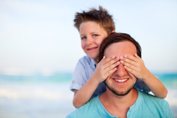 Portrait of happy father and son outdoors